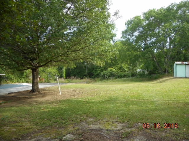 4315 Jones Road Macon, GA 31216 - Photo 6 of 26 a backyard of a house with lots of green space