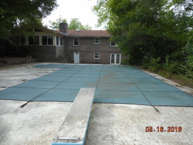 4315 Jones Road Macon, GA 31216 - Photo 8 of 26 a front view of a house with a yard