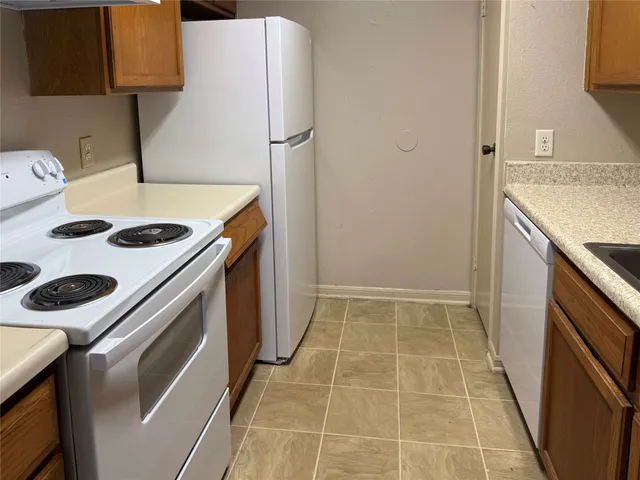 a bathroom with a tub and view of bathroom