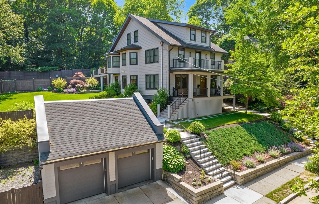 186 Mason Terrace, Unit 186 Brookline, MA 02446 - Photo 2 of 27 an aerial view of a house with a yard