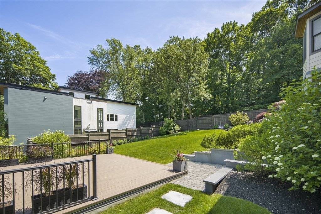 186 Mason Terrace, Unit 186 Brookline, MA 02446 - Photo 23 of 27 a view of a house with backyard and garden