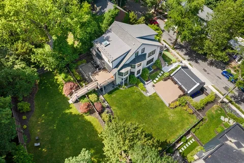 an aerial view of a house with a garden