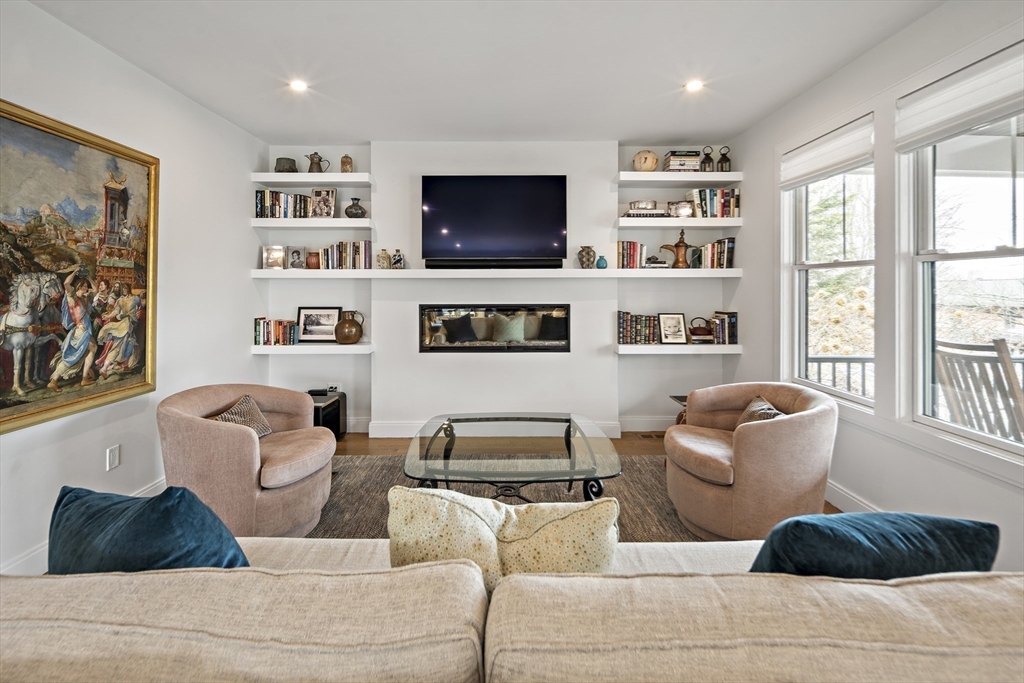 186 Mason Terrace, Unit 186 Brookline, MA 02446 - Photo 10 of 27 a living room with furniture and a flat screen tv