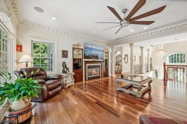 a living room with furniture and a fireplace