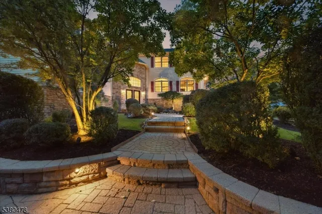a view of a large trees in front of a house