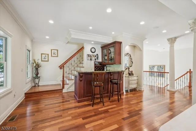 a living room with furniture and a rug