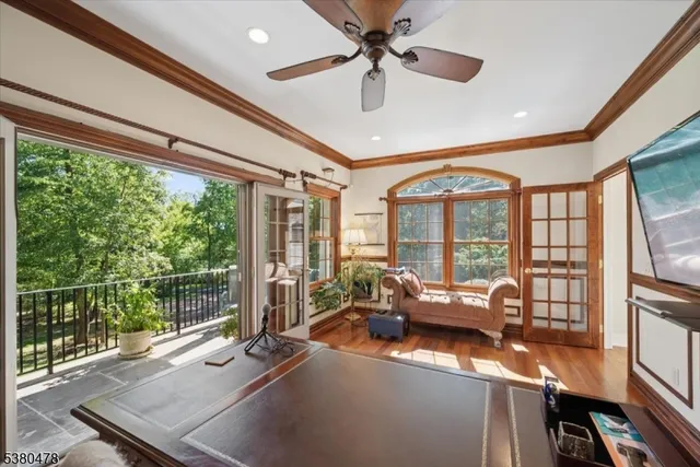 a lobby with furniture and floor to ceiling window