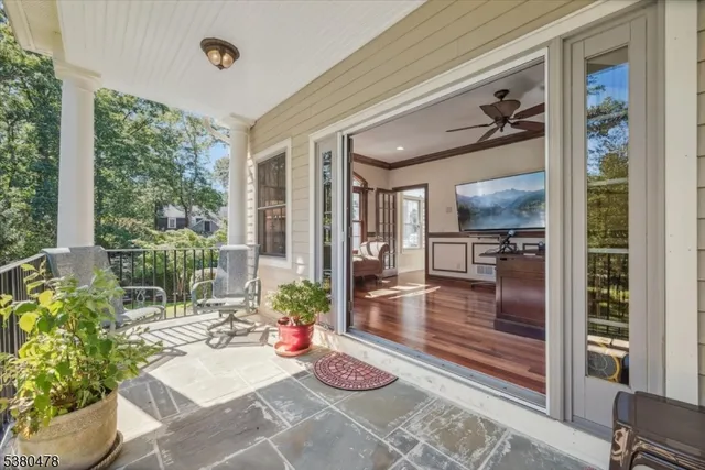a view of a house with wooden deck