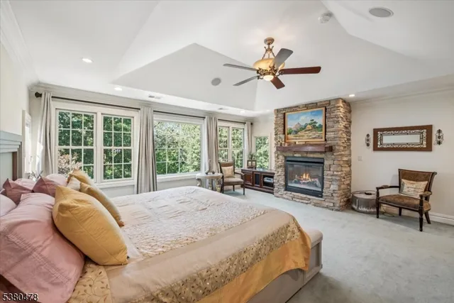 a spacious bedroom with a bed and large window