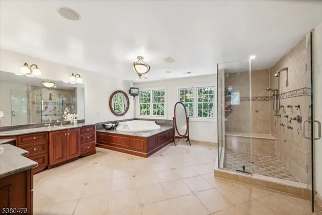 a bath room with a bath tub and a large window