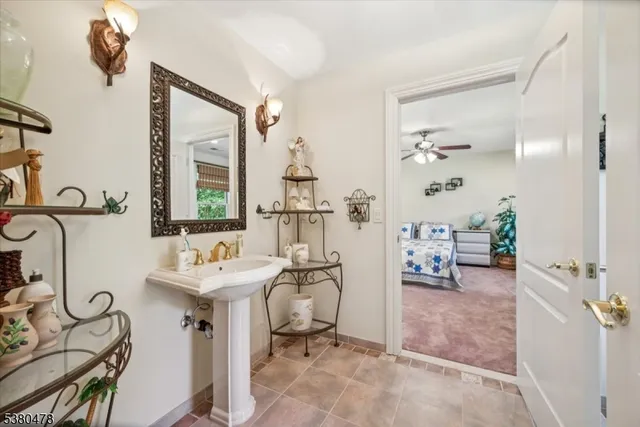 a bathroom with a toilet sink and a shower