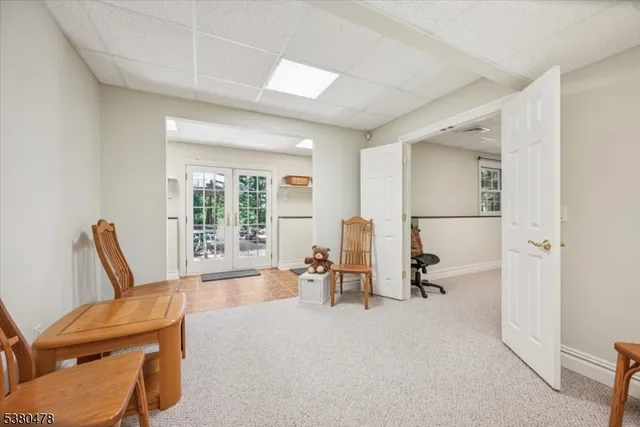 a view of a patio with table and chairs and wooden floor