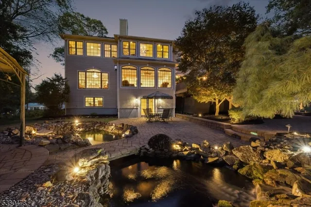 a backyard of a house with yard and outdoor seating