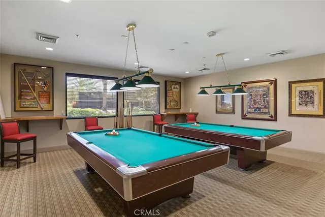 a living room with furniture a rug and a large window