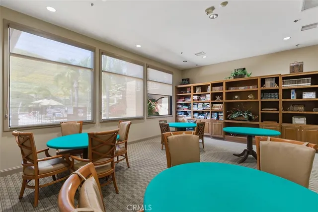an aerial view of a residential houses with outdoor space and seating
