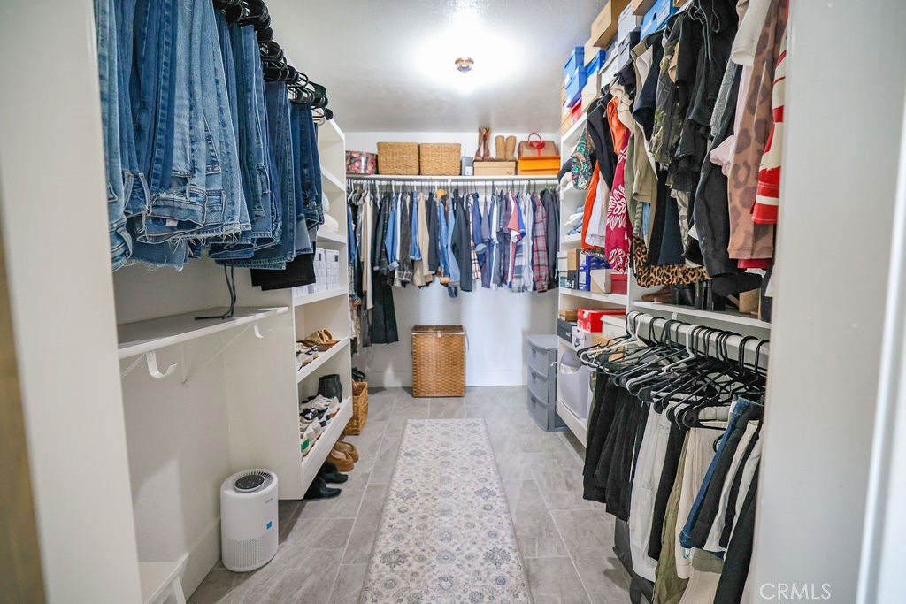 16465 Holcomb Way Riverside, CA 92504 - Photo 22 of 49 Primary Walk-in closet with barn door entrance