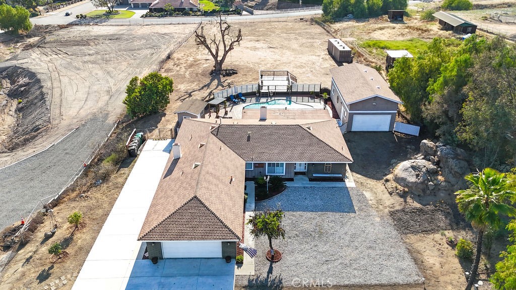 16465 Holcomb Way Riverside, CA 92504 - Photo 44 of 49 Back of property has back gate entrance. There are two storage containers on the property that are negotiable. Plenty of room for horses, toys, or an ADU