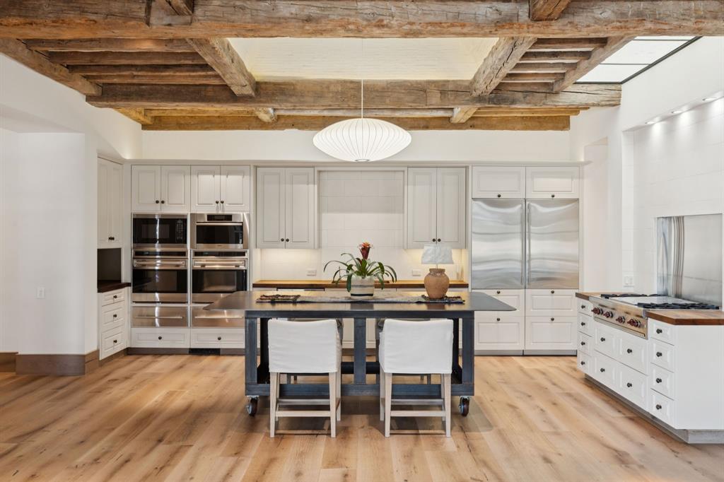 700 Jenkins Road Aledo, TX 76008 - Photo 13 of 40 a kitchen with stainless steel appliances a stove a table and chairs