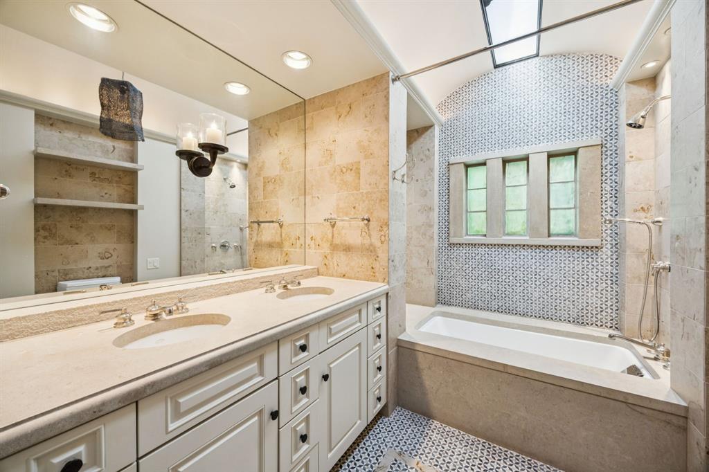 700 Jenkins Road Aledo, TX 76008 - Photo 25 of 40 a bathroom with a tub sink and mirror