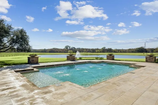 a view of a lake with houses in the back