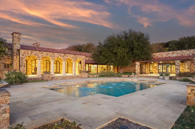 a view of a swimming pool with a patio