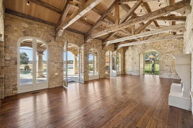 a view of an entryway with wooden floor