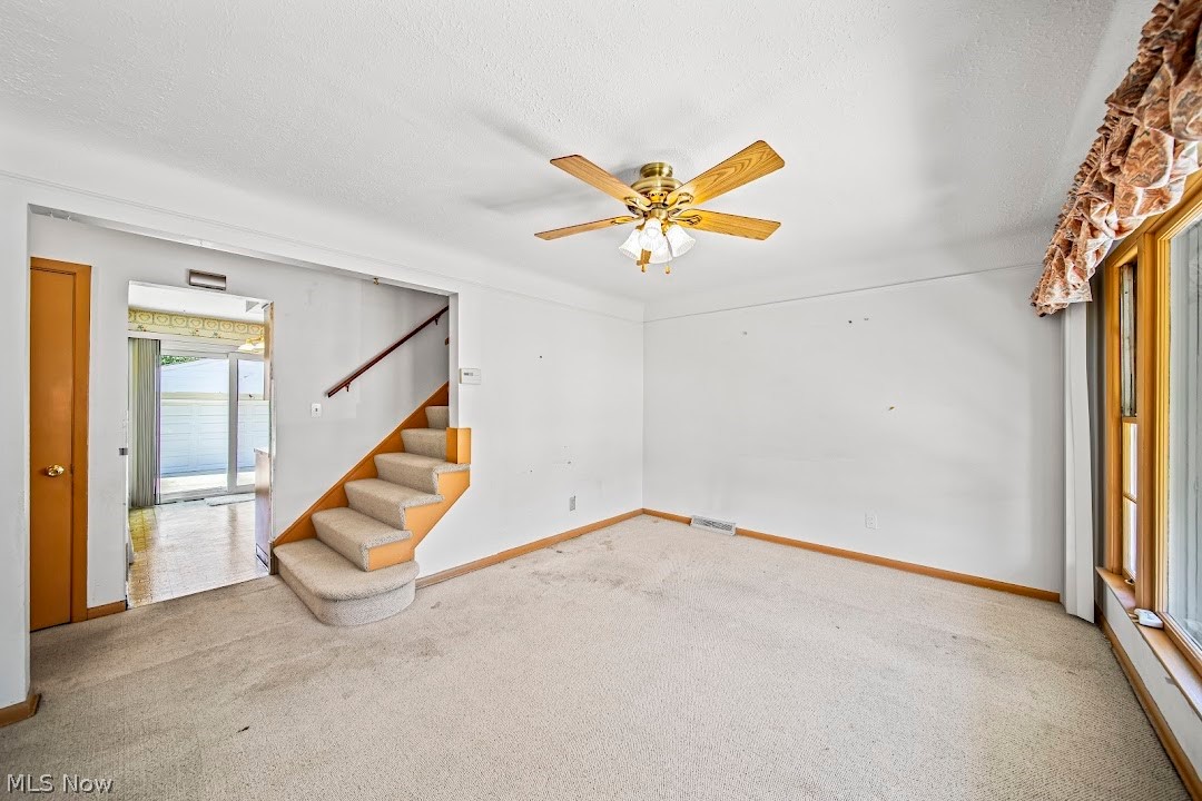 1738 Rockefeller Road Wickliffe, OH 44092 - Photo 17 of 35 Unfurnished room with carpet, ceiling fan, and a textured ceiling