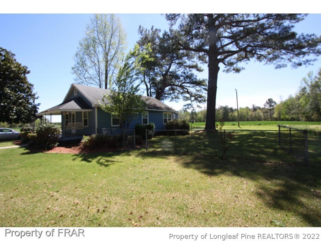 1063 Carl Freeman Road Stedman, NC 28391 - Photo 1 of 17 a view of a house with yard and a tree
