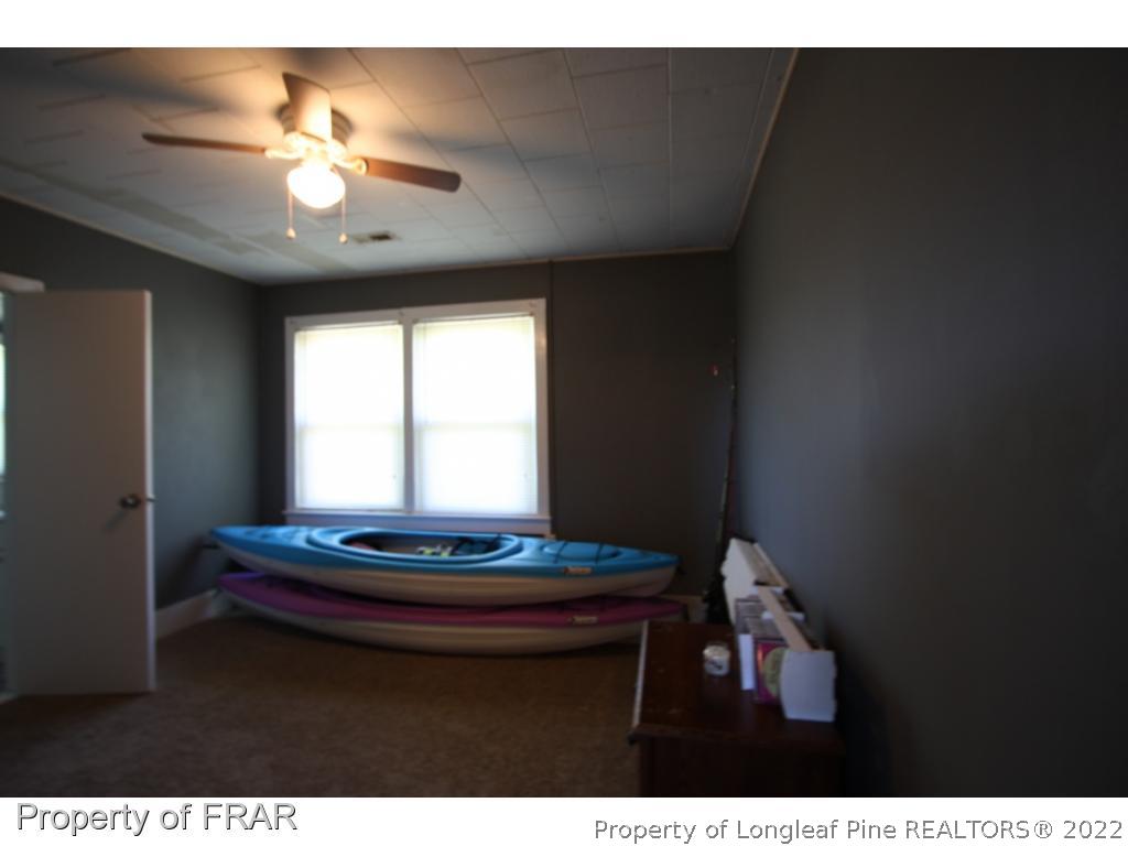 1063 Carl Freeman Road Stedman, NC 28391 - Photo 13 of 17 a living room with hard wood floor