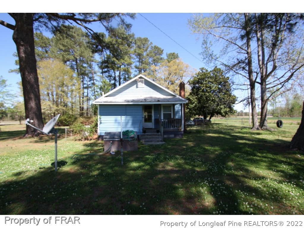 1063 Carl Freeman Road Stedman, NC 28391 - Photo 6 of 17 a view of a house with a yard