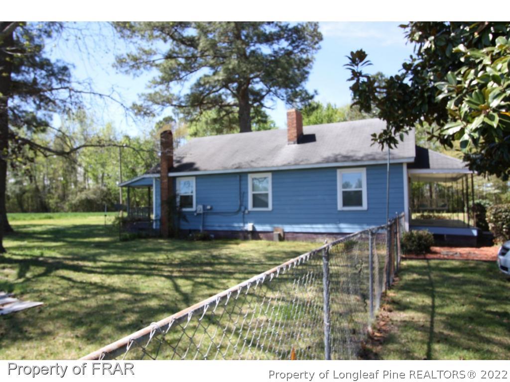 1063 Carl Freeman Road Stedman, NC 28391 - Photo 8 of 17 a view of a house with a yard