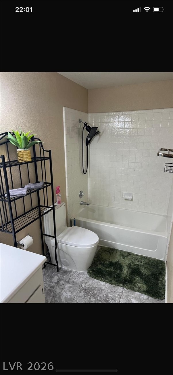 5131 South Lindell Road, Unit 205 Las Vegas, NV 89118 - Photo 12 of 22 Full bathroom with toilet, vanity, and washtub / shower combination