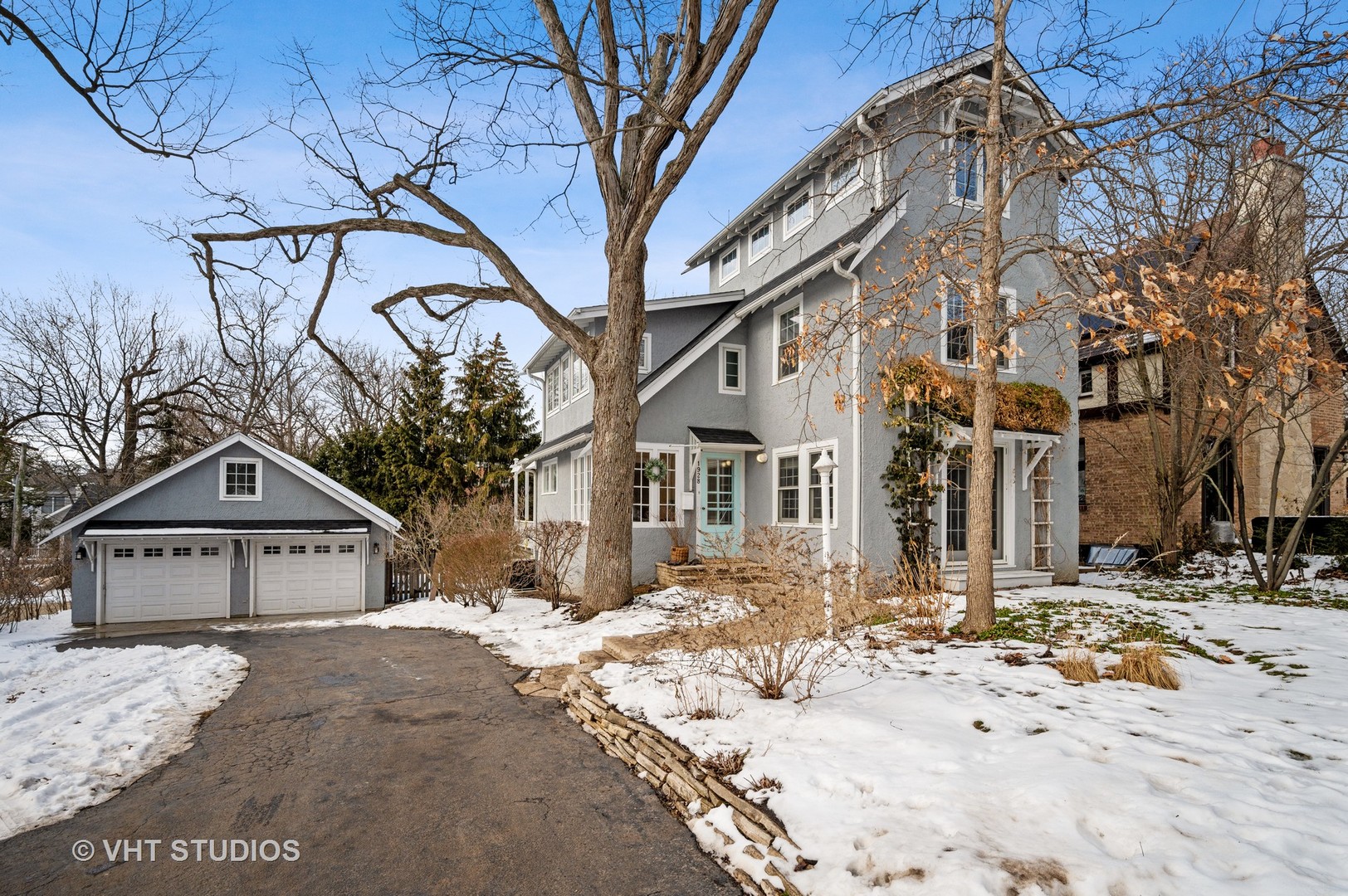1928 Sunset Road Highland Park, IL 60035 - Photo 1 of 23 a view of a house with a yard covered in snow