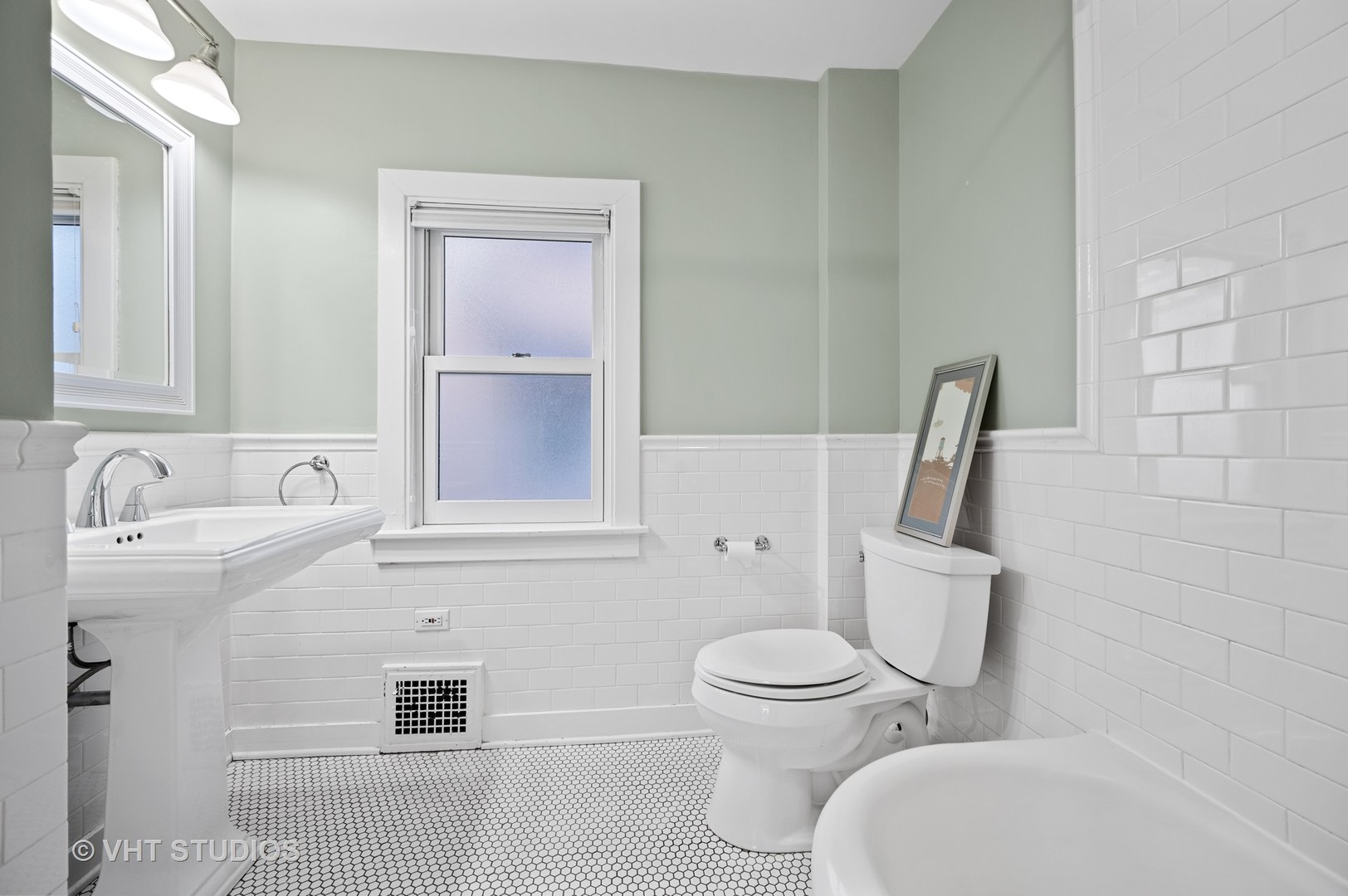 1928 Sunset Road Highland Park, IL 60035 - Photo 12 of 23 a white toilet sitting next to a bathroom sink