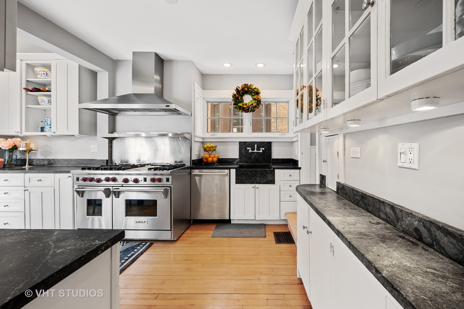 1928 Sunset Road Highland Park, IL 60035 - Photo 6 of 23 a kitchen with stainless steel appliances granite countertop a stove a sink and a microwave