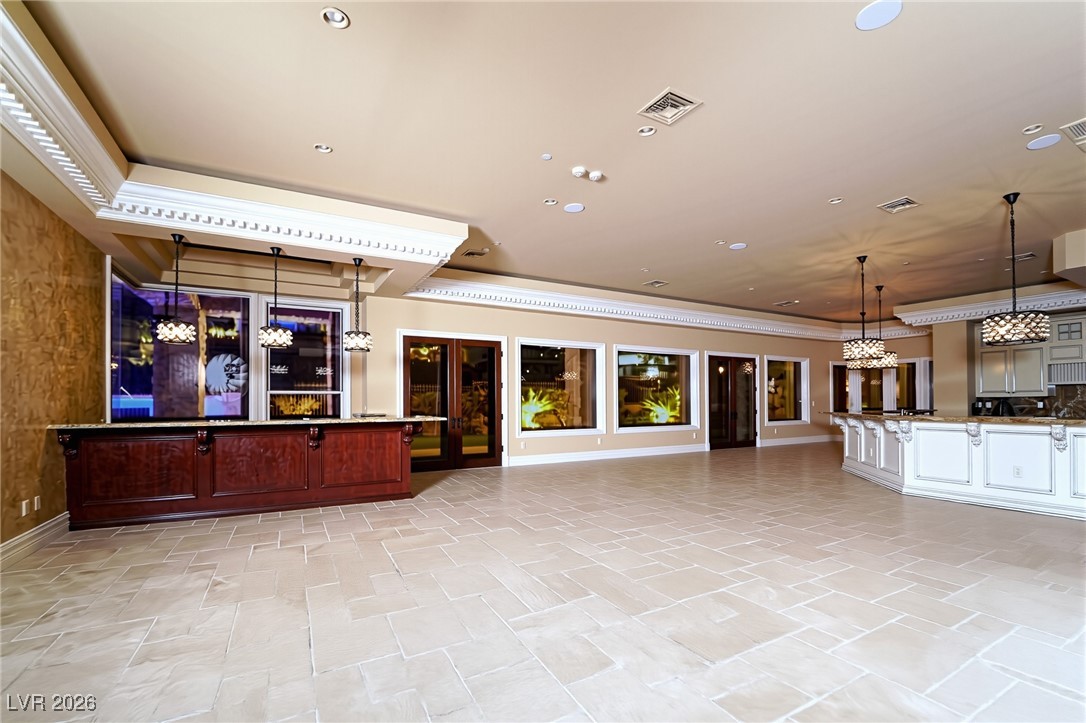 634 St Croix Street Henderson, NV 89012 - Photo 20 of 56 Family room and Kitchen featuring wet bar, recessed lighting and Venetian plaster wall.
