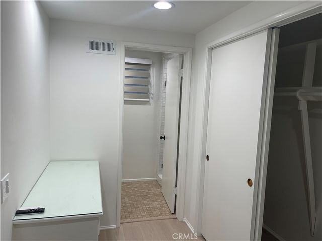 a view of bathroom with a sink and mirror