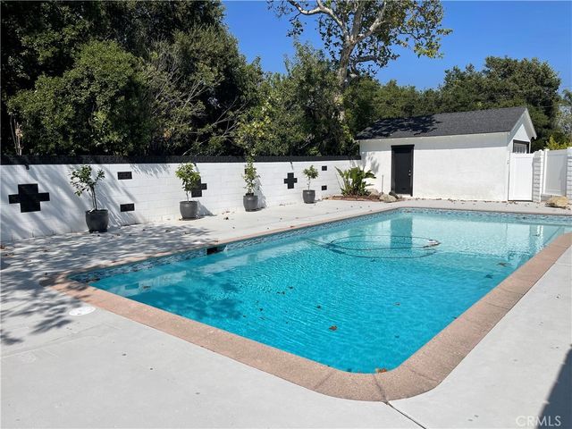 a view of a backyard with a tub