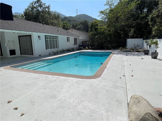 a bathroom with a tub and sink