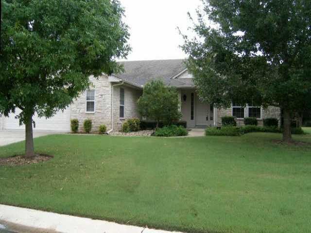 182 Trail Rider Way Georgetown, TX 78633 - Photo 1 of 1 a front view of a house with a garden