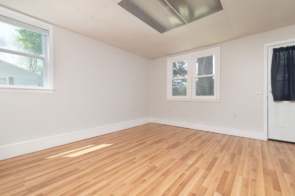 34 Clark Road Rockland, MA 02370 - Photo 10 of 37 a view of empty room with wooden floor and fan