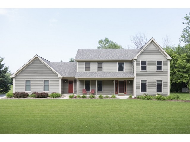 978 Plum Tree Road Fox River Grove, IL 60021 - Photo 2 of 25 a front view of a house with a garden