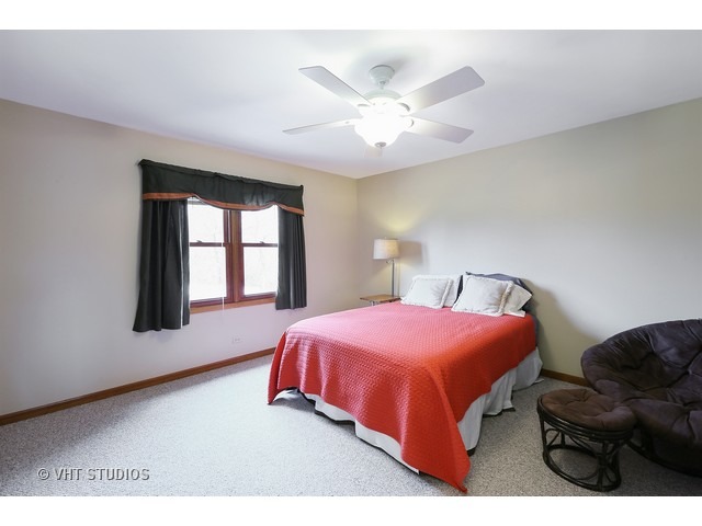 978 Plum Tree Road Fox River Grove, IL 60021 - Photo 21 of 25 a bedroom with a bed and a window