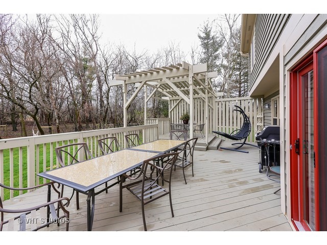 978 Plum Tree Road Fox River Grove, IL 60021 - Photo 24 of 25 a view of a chairs and table on the deck