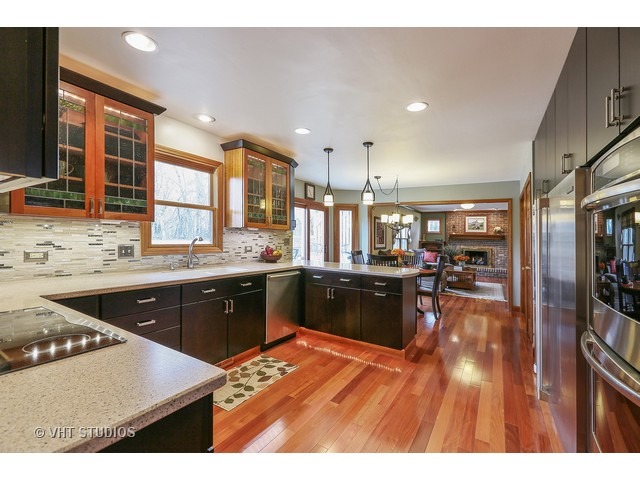 978 Plum Tree Road Fox River Grove, IL 60021 - Photo 8 of 25 a kitchen with stainless steel appliances kitchen island granite countertop a stove a sink and a refrigerator