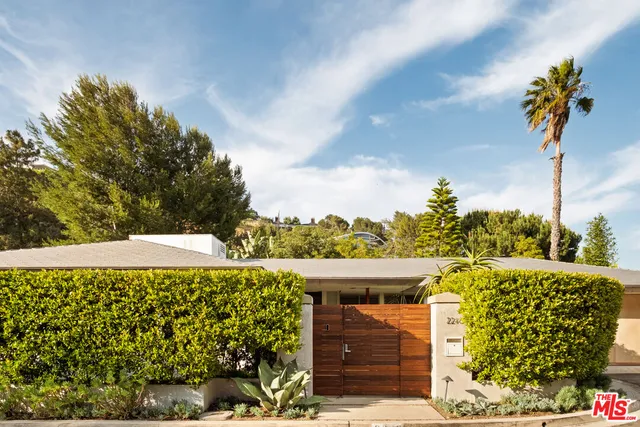 a view of a hallway with dining area and glass door