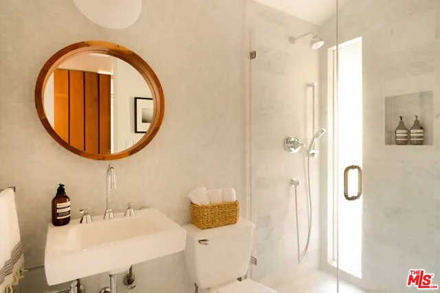 a bedroom with a balcony a bed and a couch