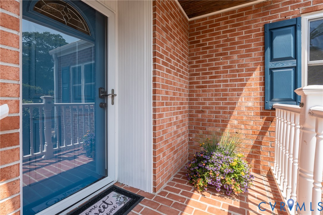 Brick exterior with a complementary blue storm doo