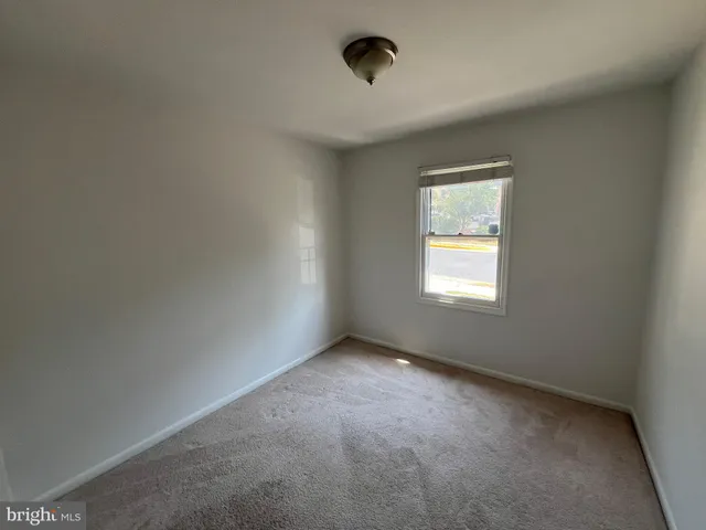 a front view of a house with plants