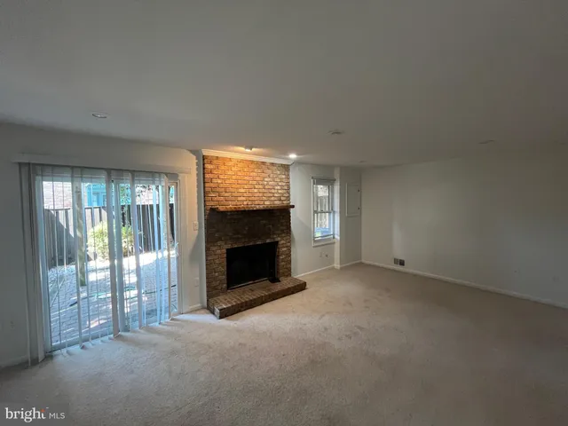 a view of a swimming pool with an outdoor seating